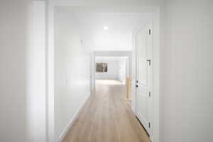 Corridor featuring light hardwood / wood-style flooring