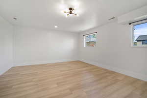 Spare room with light hardwood / wood-style flooring