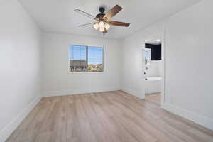 Unfurnished room with light wood-type flooring and ceiling fan