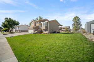 View of front of property with a front yard