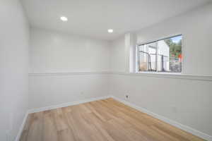 Spare room featuring light hardwood / wood-style flooring