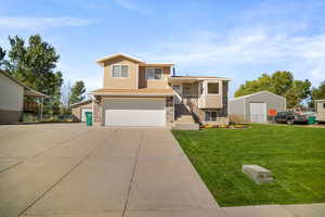 View of front of home featuring a front lawn