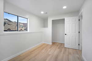 Unfurnished bedroom with light hardwood / wood-style floors