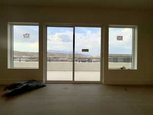 Interior space with a mountain view and tile patterned flooring