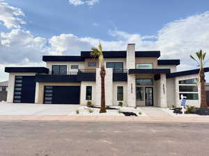 View of front facade featuring a garage