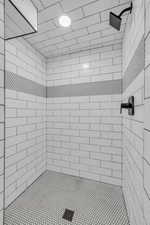 Bathroom featuring a tile shower