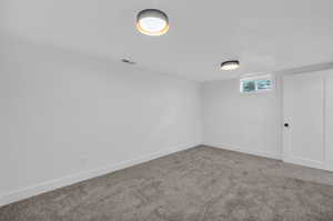 View of carpeted spare room