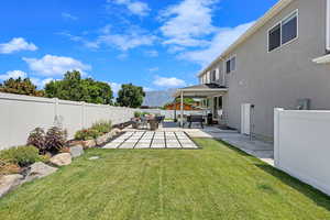 View of yard with a patio and an outdoor living space