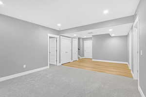 Basement featuring light wood-type flooring