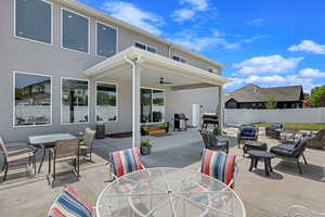 View of patio featuring ceiling fan