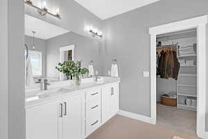 Bathroom with tile patterned flooring and vanity