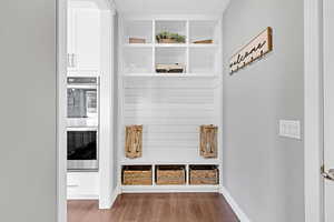 Mudroom with dark hardwood / wood-style floors