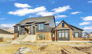 Back of property with a mountain view