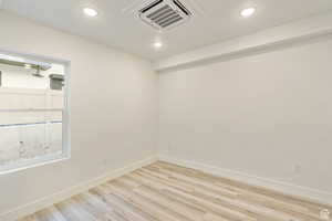 Spare room featuring light hardwood / wood-style floors