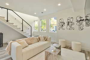 Living room with light hardwood / wood-style flooring