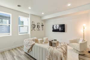 Living room with light wood-type flooring