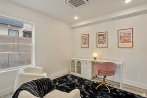 Office area featuring light hardwood / wood-style floors