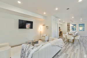 Living room with light hardwood / wood-style floors