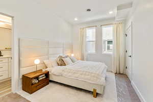 Bedroom with light colored carpet