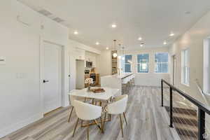 Dining area featuring light wood-type flooring