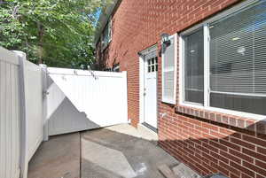 Private Patio off of kitchen.  Gate leads to covered parking