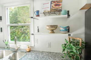 Interior details with light stone countertops and sink