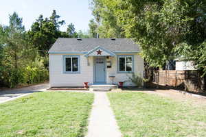 Bungalow with a front lawn