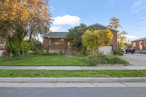 View of front of property with a front yard