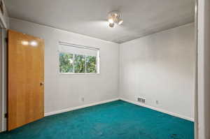 Unfurnished room with carpet floors