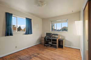 Office area featuring plenty of natural light and light hardwood / wood-style flooring