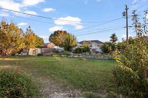 View of yard featuring a storage unit