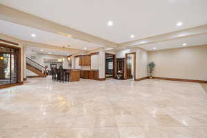 Kitchen featuring a kitchen breakfast bar, hanging light fixtures, and a center island