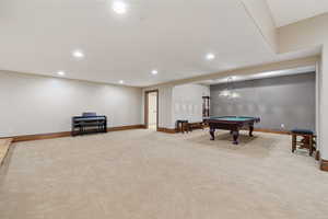 Rec room with billiards and light carpet