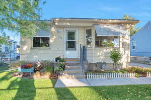 View of front of home with a front yard