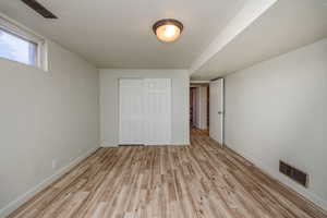 Bedroom 4 with light LVP flooring