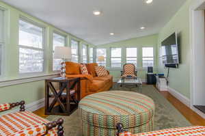 Sunroom featuring vaulted ceiling