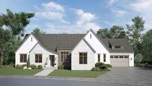 View of front facade featuring a garage and a front yard