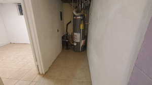 Utility room featuring water heater