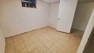 Bedroom with light tile patterned floors