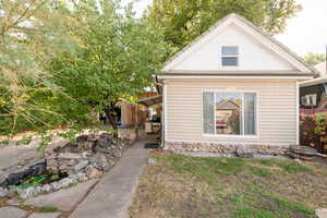 View of side of property with a patio