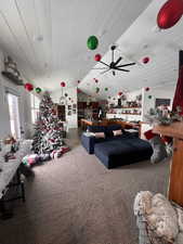 Miscellaneous room featuring lofted ceiling, ceiling fan, carpet floors, and wood ceiling