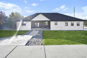 View of front of house with a front yard