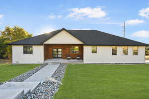 View of front of house featuring a front lawn