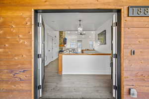 Kitchen featuring ceiling fan and dark hardwood / wood-style flooring