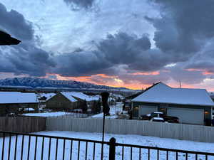 Exterior space with a garage and a mountain view