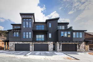 View of front of home featuring a garage