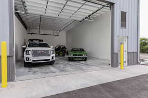 Garage featuring a carport