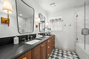 Bathroom featuring vanity and plus walk in shower