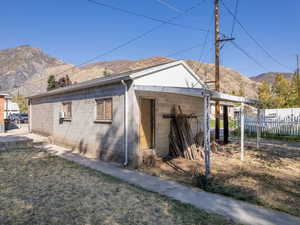 View of side of property featuring a mountain view