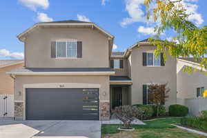 Lovely 2 Story curb appeal with modern garage door.